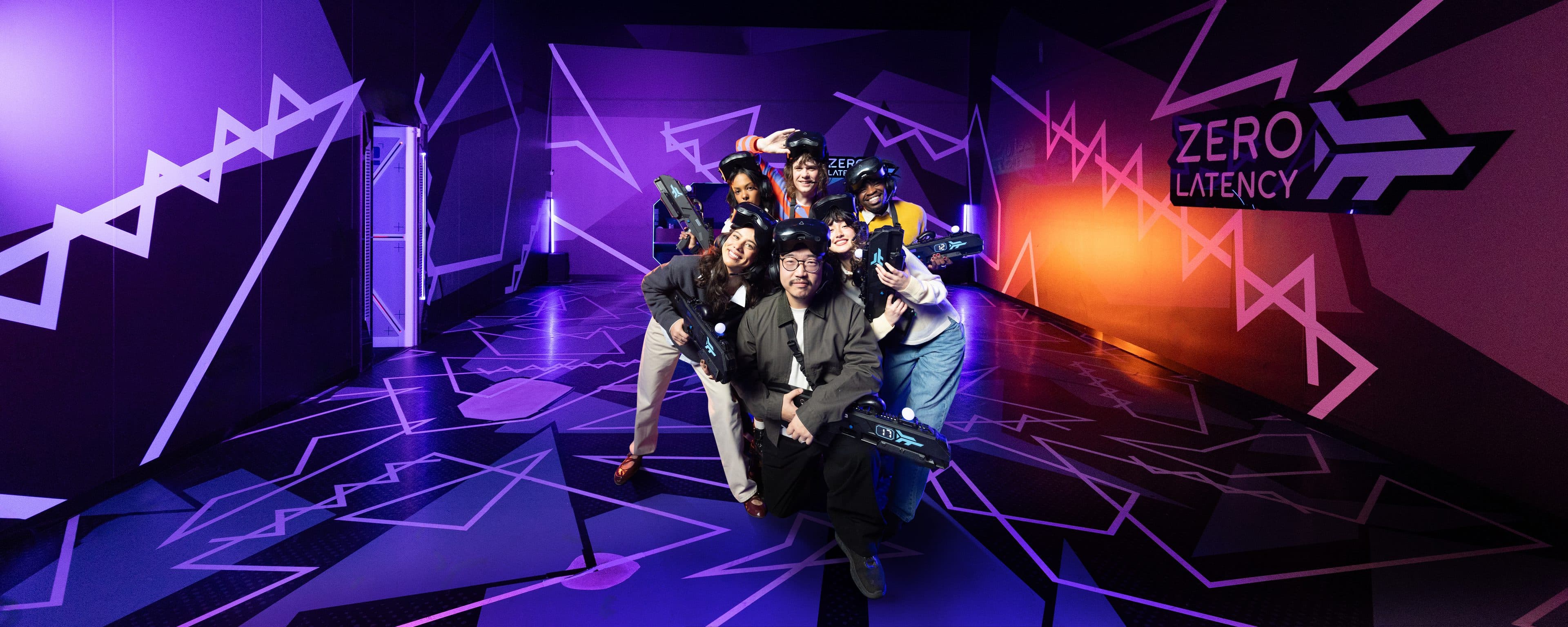 Players holding VR blasters in the Zero Latency arena
